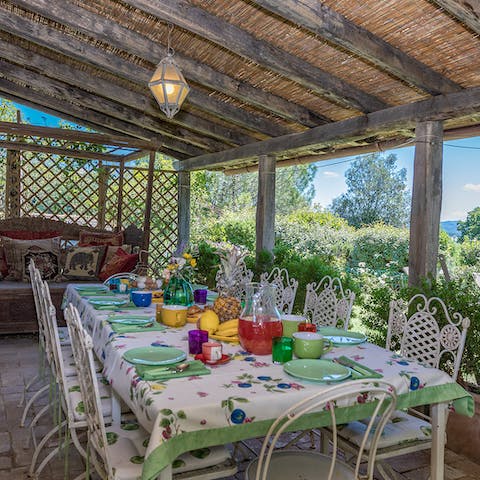 Sit down for an alfresco feast beneath the pergola