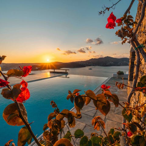 Swim laps in the infinity pool overlooking the serene bay