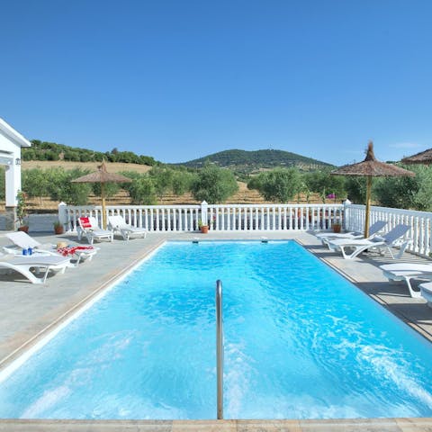 Dive into the crystal-clear waters of the private pool to cool down