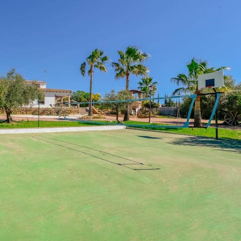 Challenge your loved ones to a game of volleyball or basketball on the courts