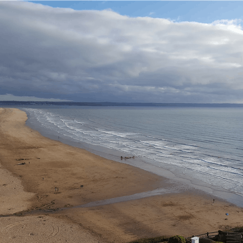 Breathe in the sea air at Saunton Sands beach, a ten-minute walk away