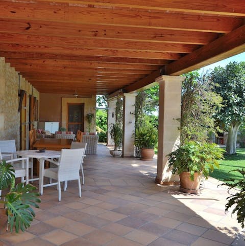 Sip pre-dinner drinks on the terrace, still warm from the day's sun