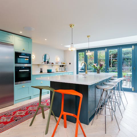 Let your culinary skills shine in the stunning aquamarine kitchen and whip up a delicious dinner for the whole family to share
