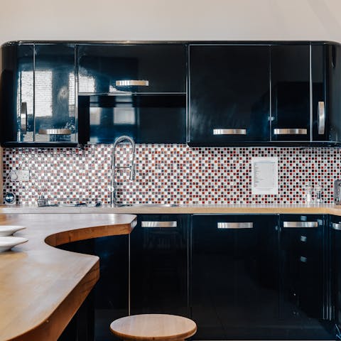 Cook your meals in the super cool black kitchen