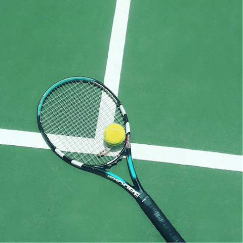 Let your competitive side out with a game of tennis or pickleball at the shared courts