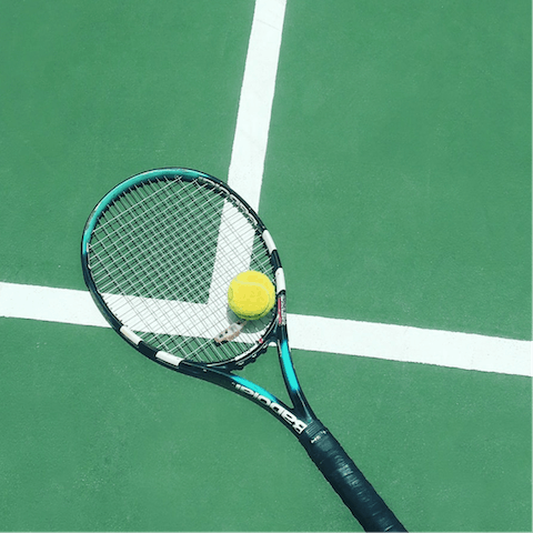 Let your competitive side out with a game of tennis or pickleball at the shared courts