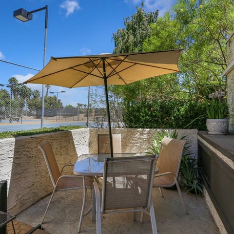 Sit down to an alfresco meal beneath the sun umbrella
