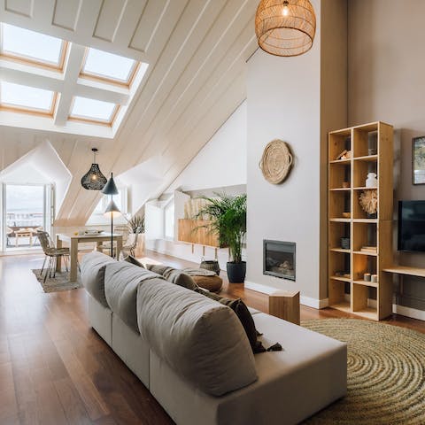 Kick back in the stylish living room as sunlight pours in through the large skylight