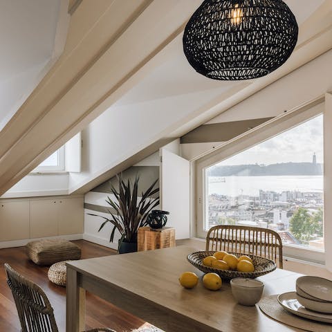 Sit down to a meal in the bright dining area while feasting on views of the Cristo Rei statue above the southern banks of the Tejo Estuary