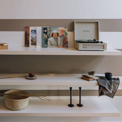 Chill out by the living room's fireplace while listening to a record
