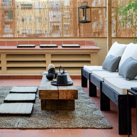 Relax in refined style on your screened outdoor terrace