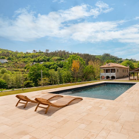 Soak up the sun beside the private heated pool