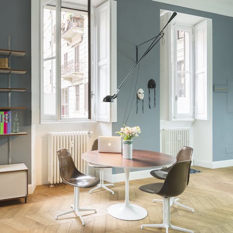 Sit at the table by the large windows – perfect spot to work-from-home, enjoy a meal or people watch
