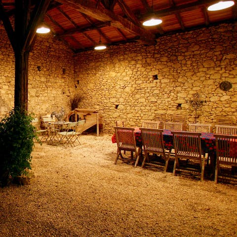 Have a candlelit apéritif in the courtyard