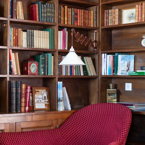Curl up with a book selected from the home library
