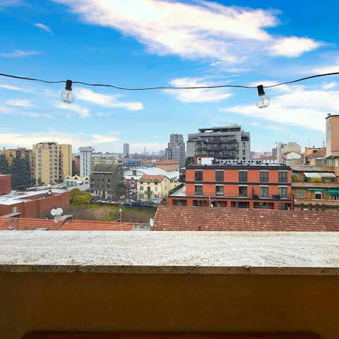 Take in the views over Milan from the balcony