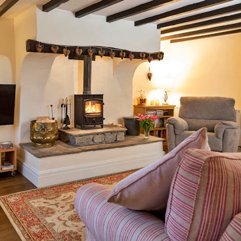 Throw another log on the fire as you settle in for a movie night beneath the beams