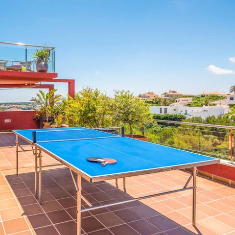 Get competitive over a game of ping pong in the sunshine