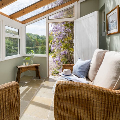 Take in the garden's scenery from the comfort of the conservatory, a mug of tea and a good book in hand
