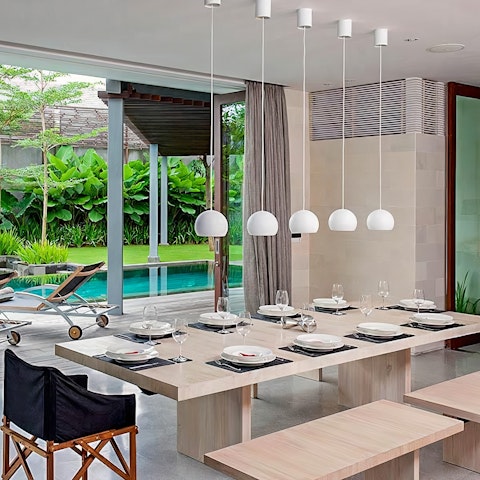 Dine elegantly around the sleek wooden dining table