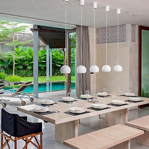 Dine elegantly around the sleek wooden dining table