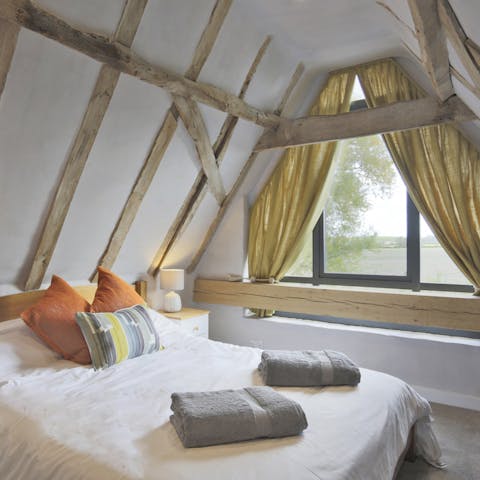 Enjoy far-reaching views towards the river from the characterful bedroom