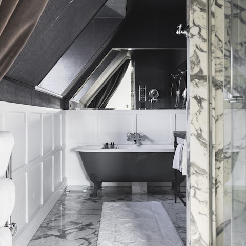 Treat yourself to a relaxing soak in the roll-top bathtub