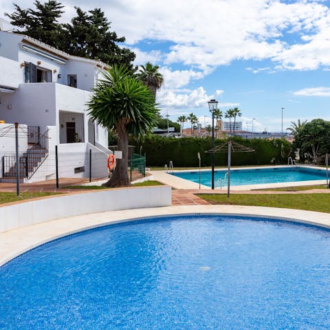 While away the afternoons around the shared swimming pools