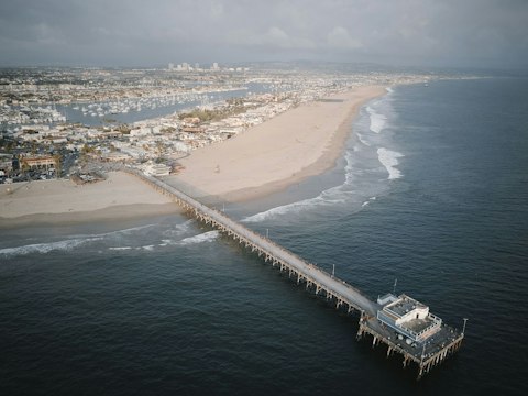 Stroll Newport Beach Pier for Pacific Ocean panoramas, a seventeen-minute drive