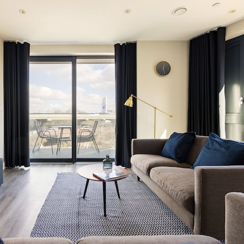 Relax with a glass of wine in the bright open-plan living room