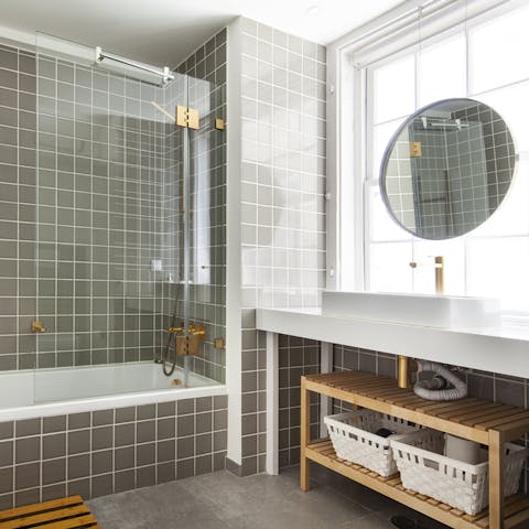 Get mornings off to a luxurious start in the green and gold bathroom