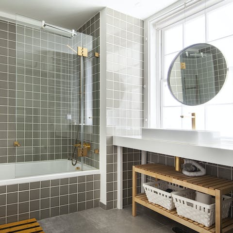 Get mornings off to a luxurious start in the green and gold bathroom