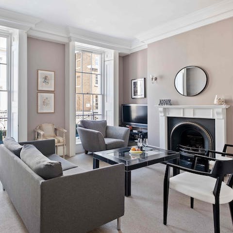 Relax in the elegant living room with a glass of wine