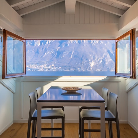 Savour views of the Bay of Pescallo from the dining area