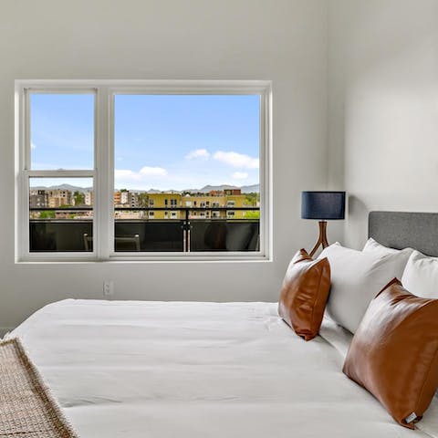 Wake up to glorious views of the Rockies in the comfortable bedroom