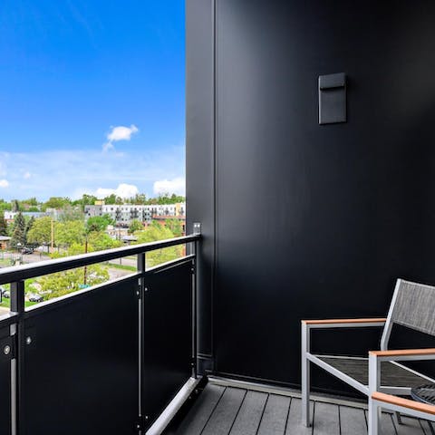 Sip a cold beer on the private balcony while you watch the sunset over the city