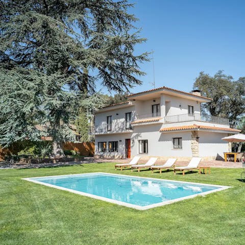 Relax in the garden before cooling off in the private pool