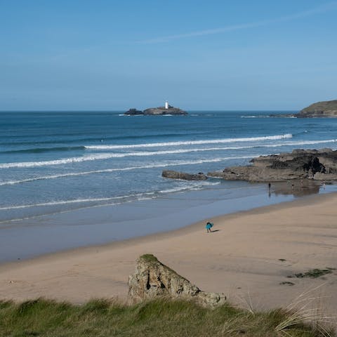 Roll up your trousers and go paddling at Gwithian Beach, a seven-minute walk away