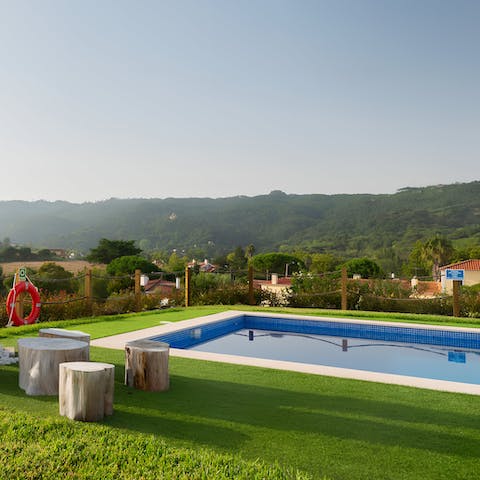 Cool off in the private pool while admiring the hilly views