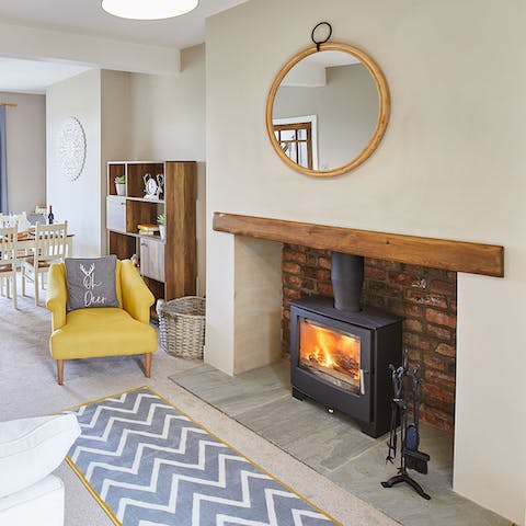 Curl up in the yellow armchair beside the stove on chilly evenings