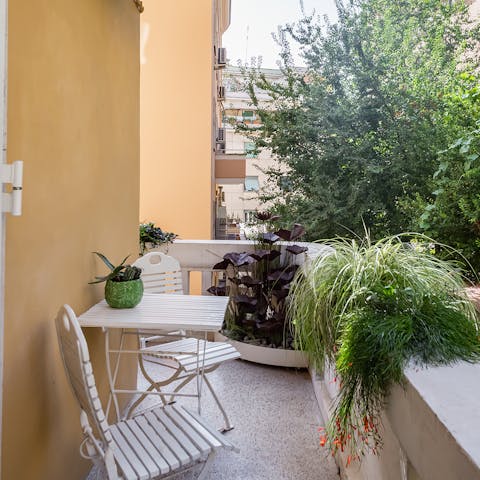 Sip on a delicious cup of coffee on the verdant balcony