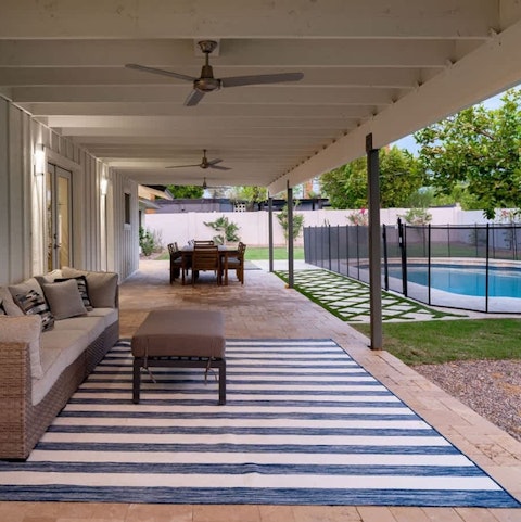 Spend your days in the pool and lounging on the patio