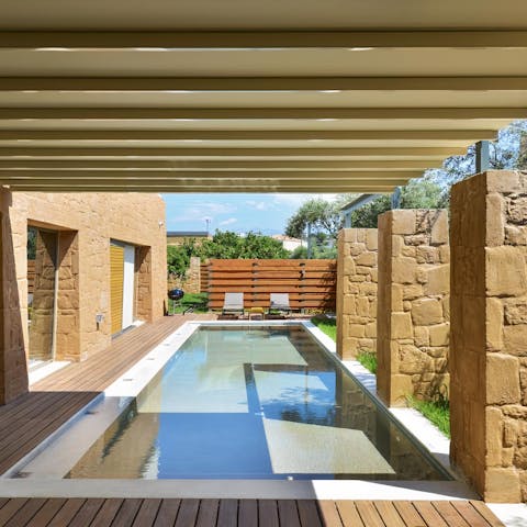 Enjoy a refreshing dip in your pool to cool off from the Cretan heat