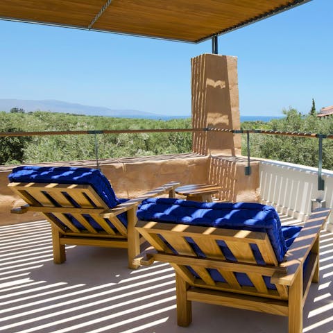 Soak up the distant sea views from your private balcony