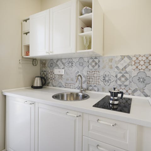 Cook snacks or meals in the compact kitchen