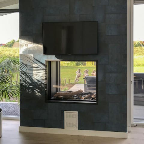Warm up by the statement fireplace