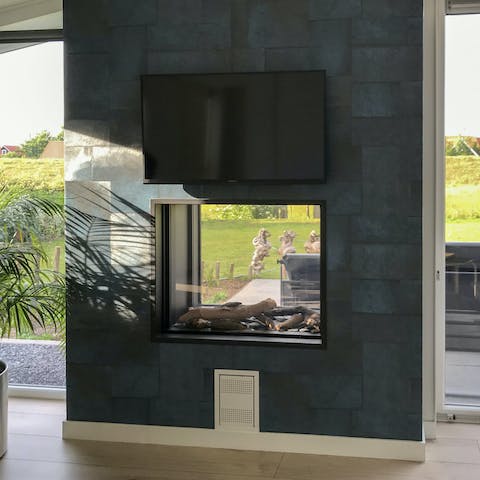 Warm up by the statement fireplace