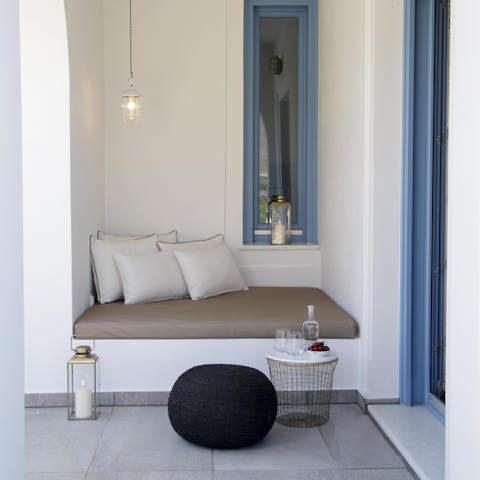 Get cosy on the benches tucked underneath traditional blue-painted windows