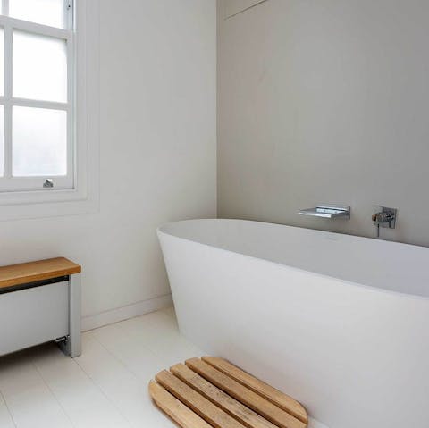 Enjoy a soak in the luxurious bathroom after a day adventuring