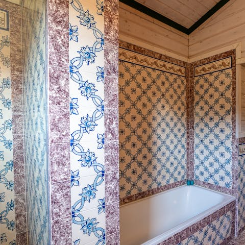 Enjoy a soak in the traditional azulejos bathroom